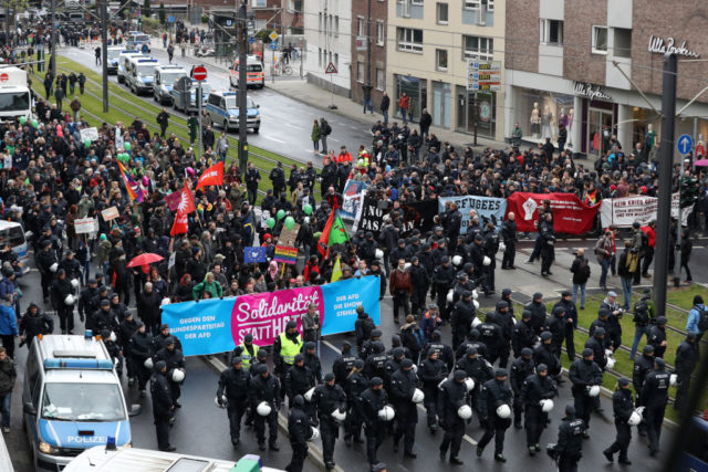 COLOGNE, GERMANY - APRIL 22: Protesters demonstrating against the right-wing populist Alternative for Germany (AfD) political party federal congress on April 22, 2017 in Cologne, Germany. Up to 50,000 people were expected to participate in the protests against the AfD, which is holding its federal congress of delegates following the recent surprise announcement by its chairwoman Frauke Petry that she will not run in German federal elections scheduled for September. The AfD saw a surge in popularity that helped it capture seats in 10 state parliaments, though more recently that party has seen its poll numbers slip. It has also been plagued by infighting between more moderate and radical factions of its leadership. (Photo by Maja Hitij/Getty Images)